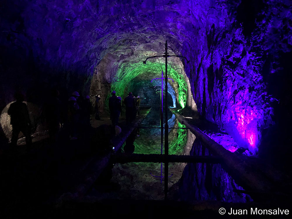 Honorable mention photo by Juan Monsalve: Underground tunnel illuminated with purple and green light, at the Nemocón Salt Mine in Colombia